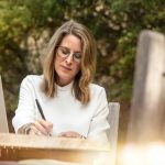 Woman practicing gratitude in her journal